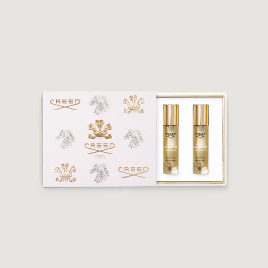 a box of three 10ml fragrance vials decorated with gold embossed creed logo and fleur de lis