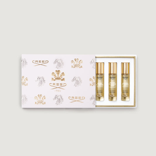 box of five 10ml fragrance vials decorated with gold creed logo and fleur de lis