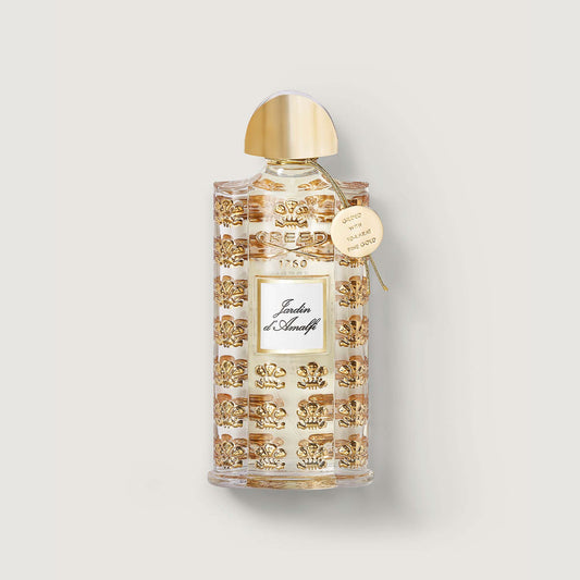 Jardin d'Amalfi bottle of jardin d'amalfi with gold lid, gold embossed repeated pattern of the fleur de lis and medallion