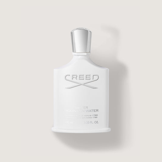 100ml white bottle and silver cap labelled Silver Mountain Water with the creed logo