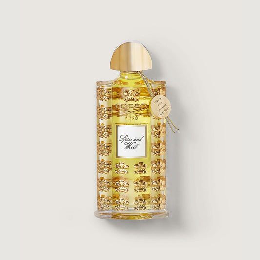 75ml bottle labelled spice and wood with gold cap, gold medallion and gold fleur de lis repeated pattern 
