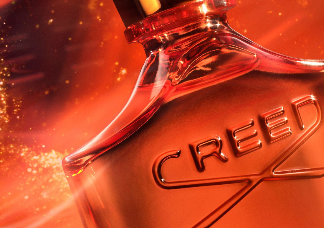 a bottle or original Santa leaning on white stone