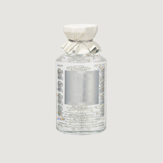 100ml white bottle and silver cap labelled Silver Mountain Water with the creed logo