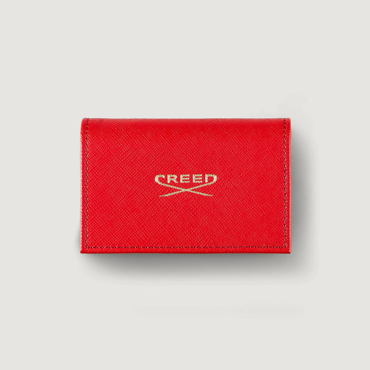 red leather wallet with gold creed embossed logo containing 8 1.7ml sample vials